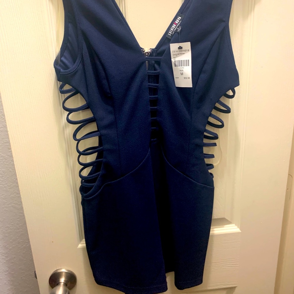 Navy blue romper with cut out sides.